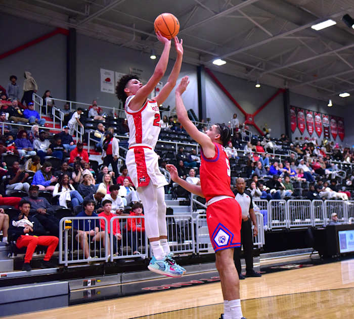 Mustang junior Roman Miller launches a shot during a game this season. Miller was named first team All-District and was the leading scorer for District 1-6A.
